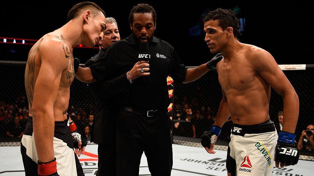 Max Holloway and Charles Oliveira are given their final instructions by the refree