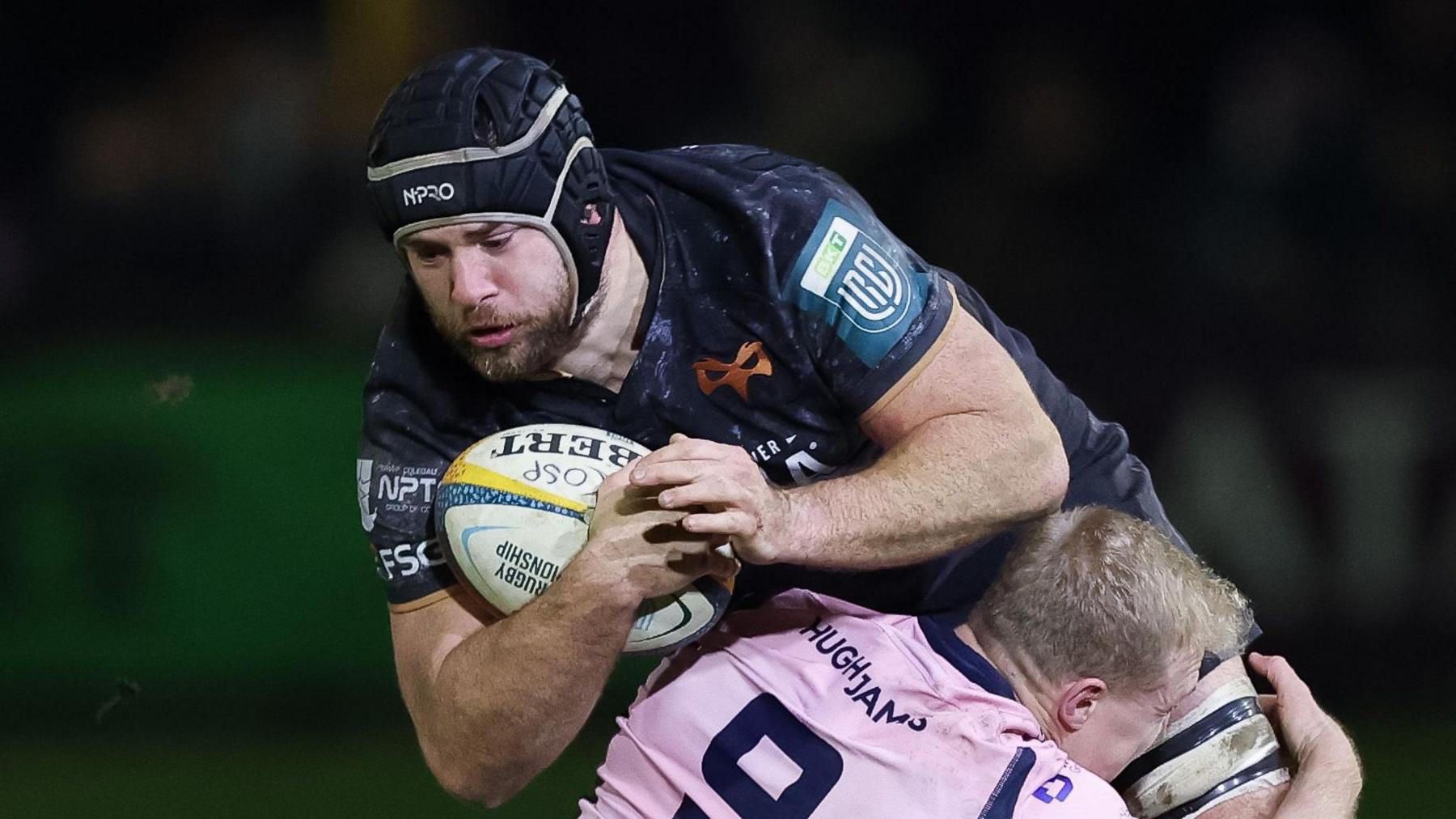 Ospreys number eight Morgan Morris is tackled in the derby against Cardiff