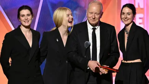 Getty Images Inga Ibsdotter Lilleaas, Elle Fanning, Stellan Skarsg&aring;rd, and Renate Reinsve accept Best Intergen/Foreign for "Sentimental Value" onstage during the 2026 Annual Movies for Grownups Awards with AARP at Beverly Wilshire, A Four Seasons Hotel on January 10, 2026 in Beverly Hills, California.