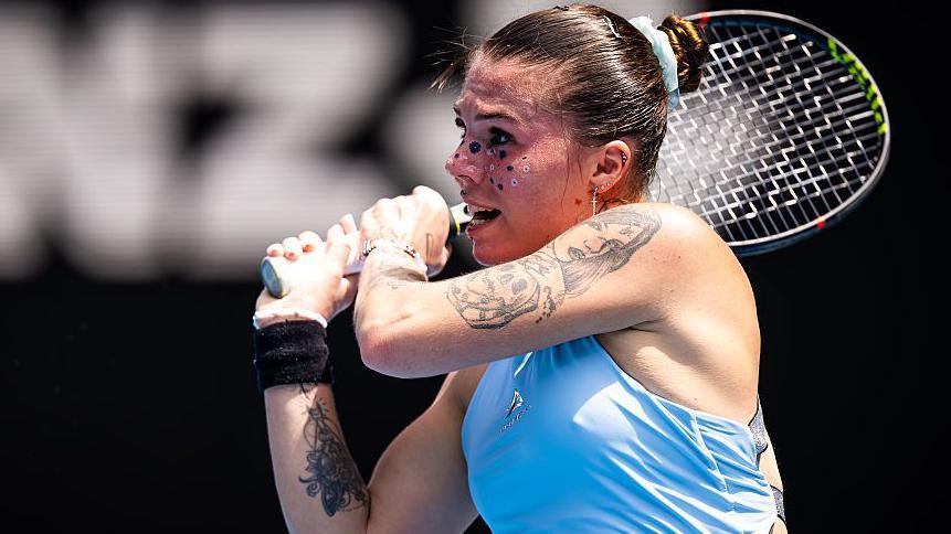 Oleksandra Oliynykova plays a shot at the Australian Open