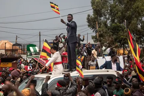 ‘Hounded and harassed’: The former pop star taking on Uganda’s long-time president