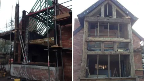 Celia Wilson Two side‑by‑side photos showing a brick building under major construction.  Left photo: A partially built structure stands surrounded by scaffolding. The walls are made of red brick, and the wooden roof frame is exposed, with green timbers forming the skeleton of a pitched roof. Several beams and planks are supported by metal poles, and ladders lean against the structure. The lower part of the building is open, with no windows or doors installed yet. Building materials and tools are scattered around the site.  Right photo: This image shows the front of the same building from a straight‑on view. The full height of the structure is visible&mdash;three storeys tall&mdash;with a steep, triangular roof. The fa&ccedil;ade features large, thick, weathered wooden beams forming the framework for what will likely be large windows. The interior is still empty and unfinished, with floors and ceilings visible through the open spaces. A ladder stands inside the ground floor, and more scaffolding is set up around the sides.