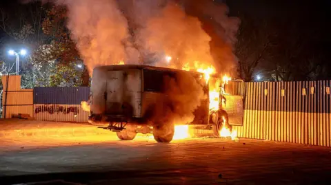 AFP via Getty Images A vehicle burns during protests in Tehran, Iran, on January 8, 2026.