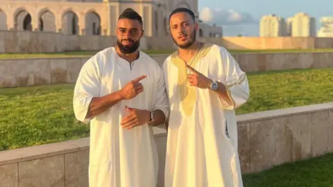 Handout Latif Adeyole and Walid Bouzaghar stand outside a mosque together.