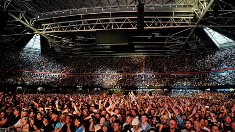 Jordan Pettitt | PA Media Packed stadium with a view from the stage, showing all the way to the back