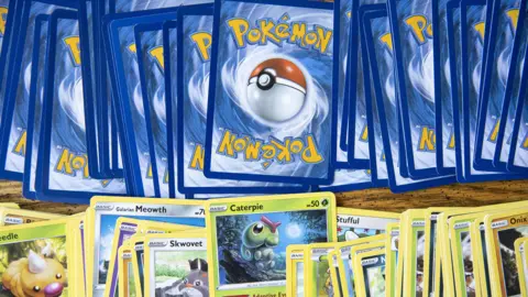 Getty Images A row of rear facing Pok&eacute;mon cards with a row of front facing cards beneath