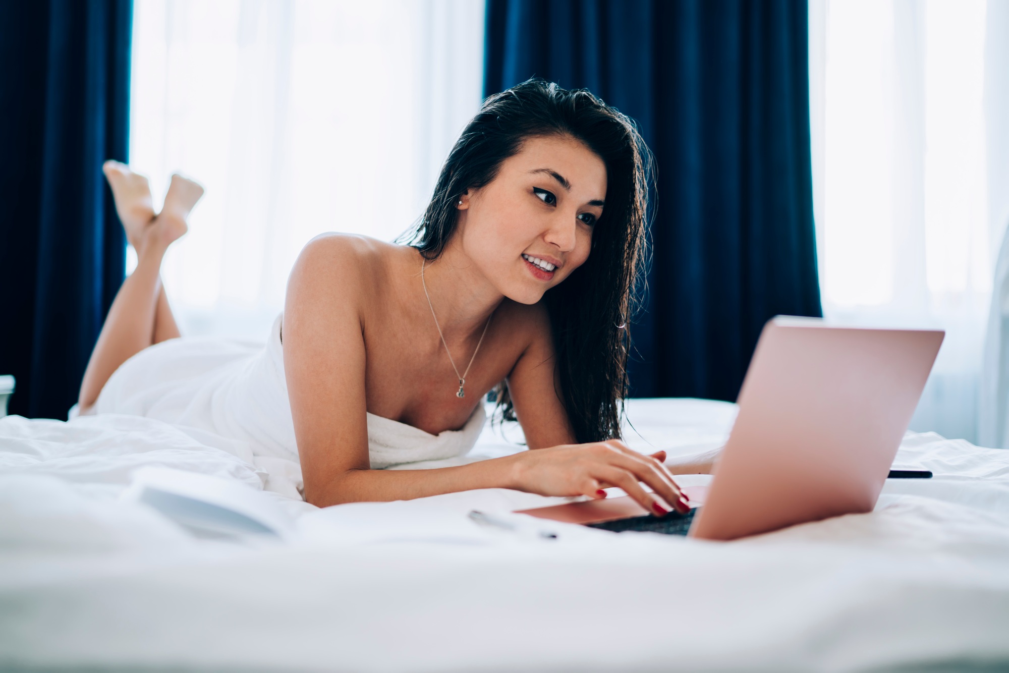 Happy blogger browsing social media networks via netbook app