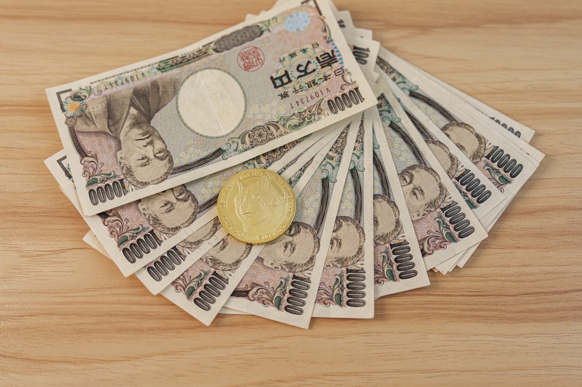 Japanese Yen banknote with gold Dogecoin cryptocurrency