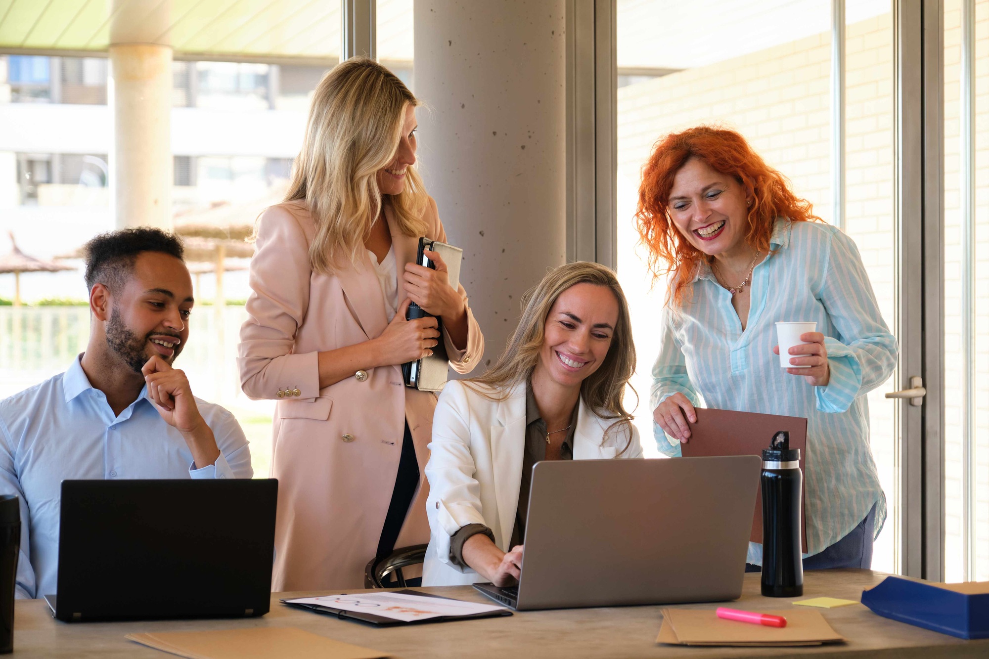 Multiethnic and business group of people laughing and doing team building.