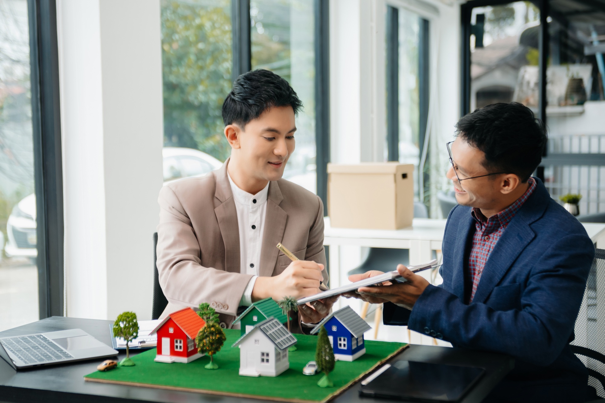 Sales giving male customer signing sales contract, Asian man doing business in office, business