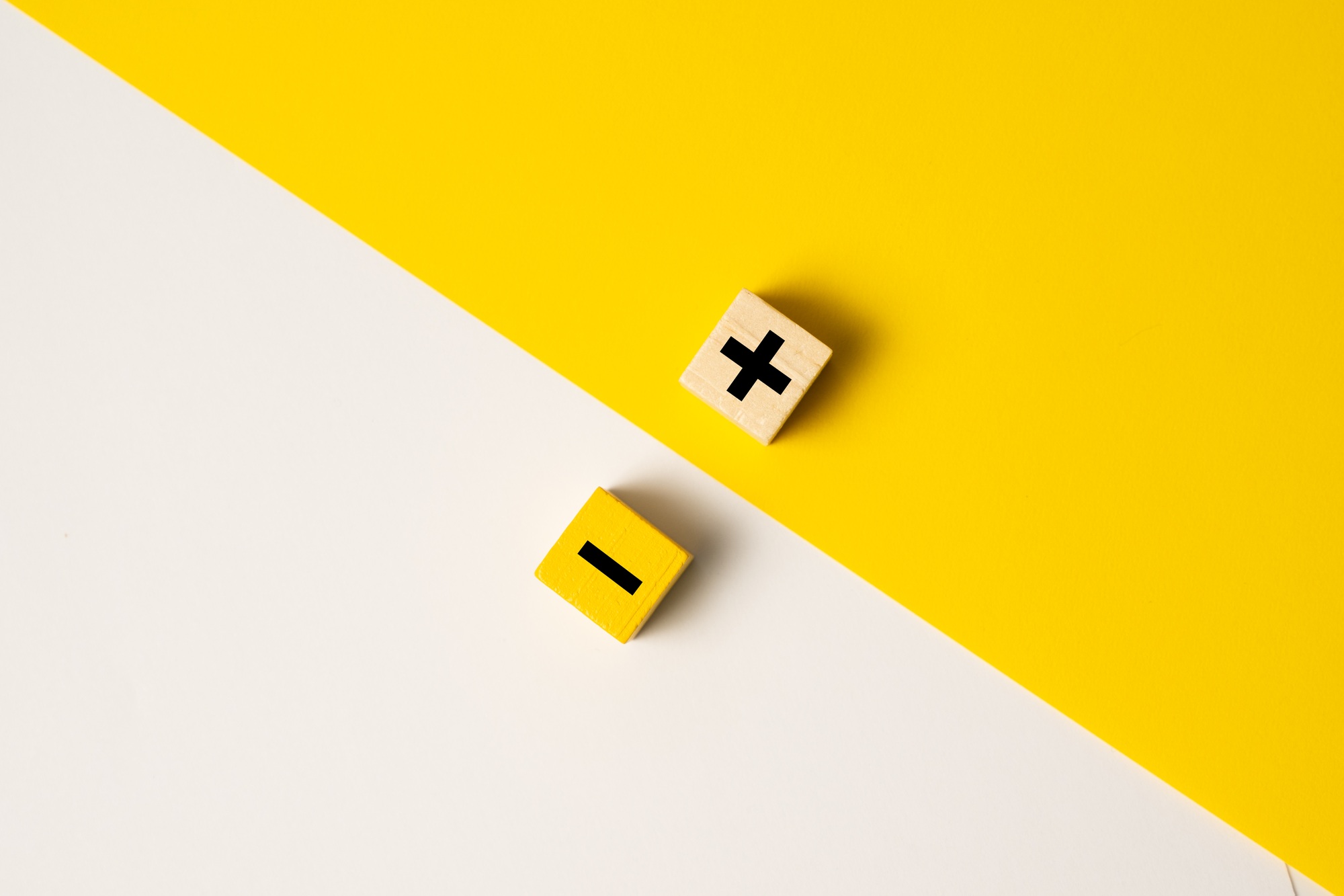 The concept of opposites or pros and cons using plus and minus signs