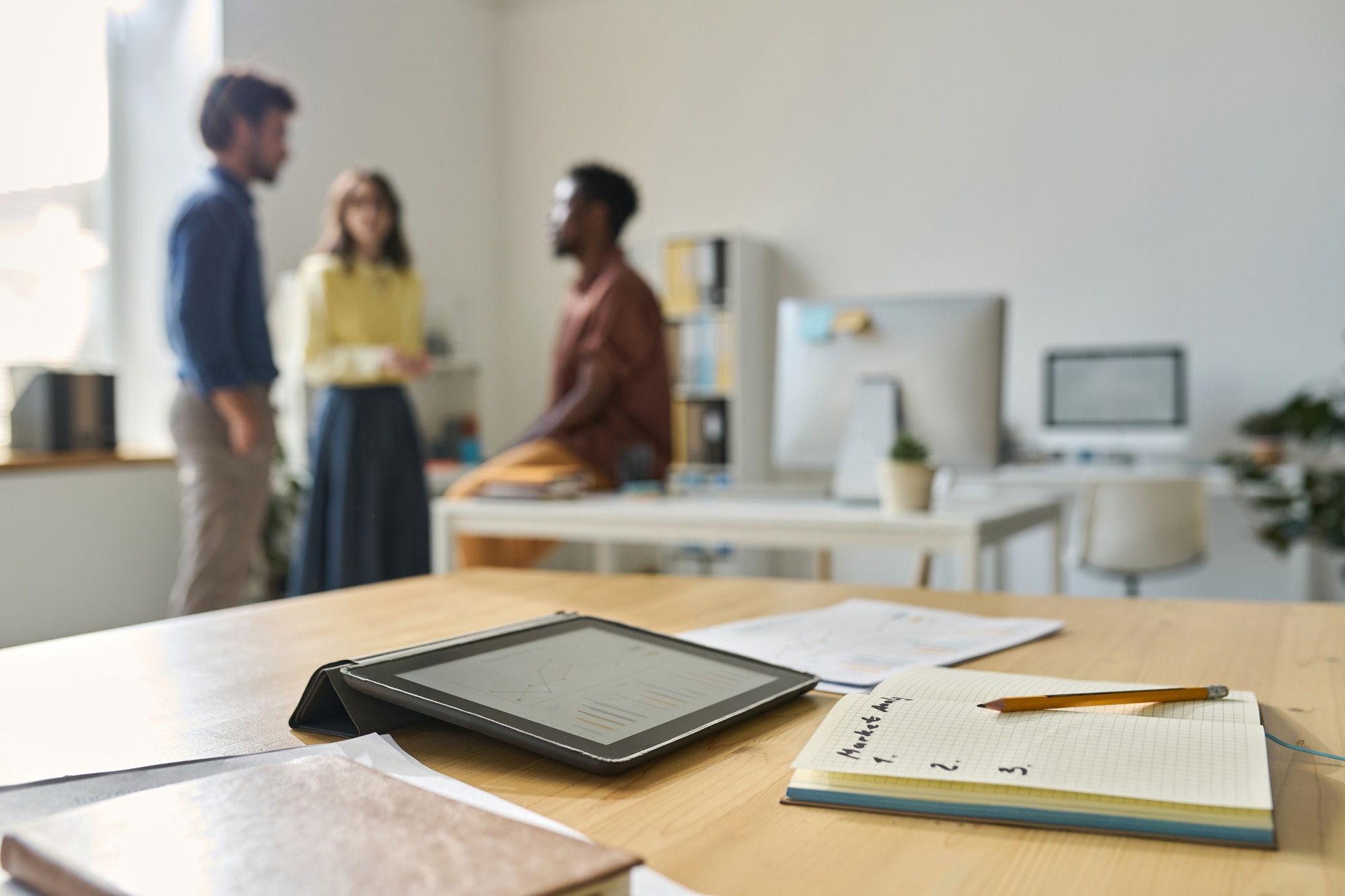 Workplace with tablet pc and notepad