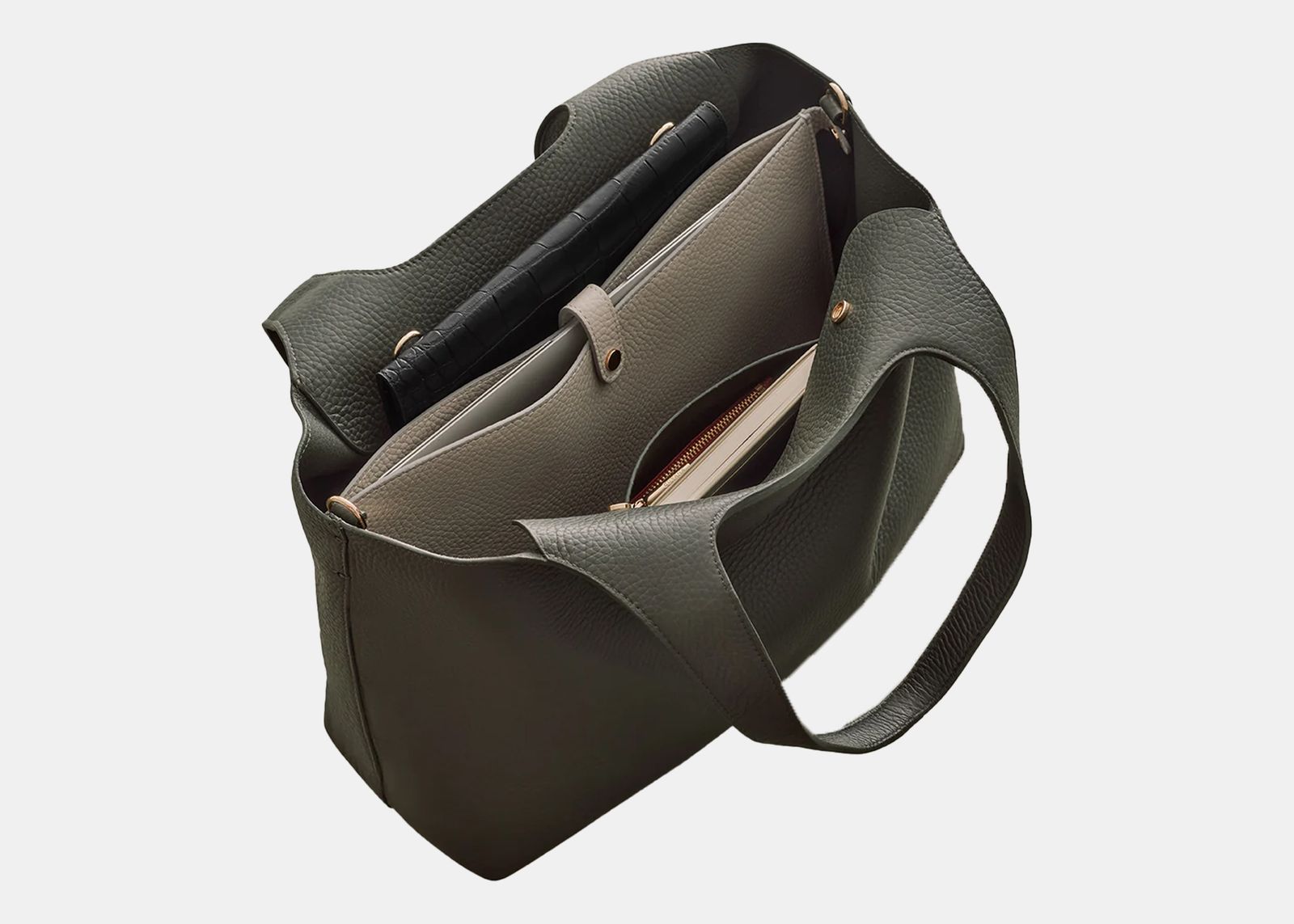 Olive green leather bag open with contents inside