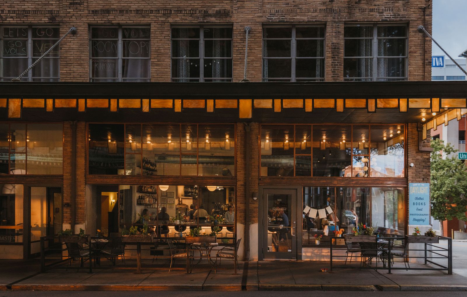 Image may contain Urban City Architecture Building Indoors Restaurant Cafe Shop Chair Furniture Person and Road