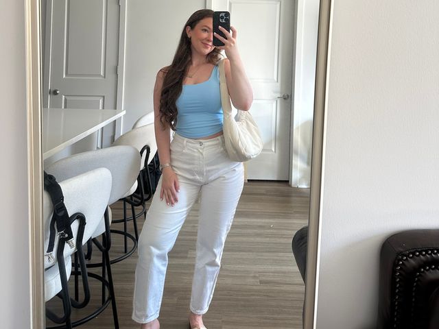 Image may contain: Clothing, Pants, Jeans, Photography, Accessories, Bag, Handbag, Footwear, Shoe, Adult, Person, and Jewelry