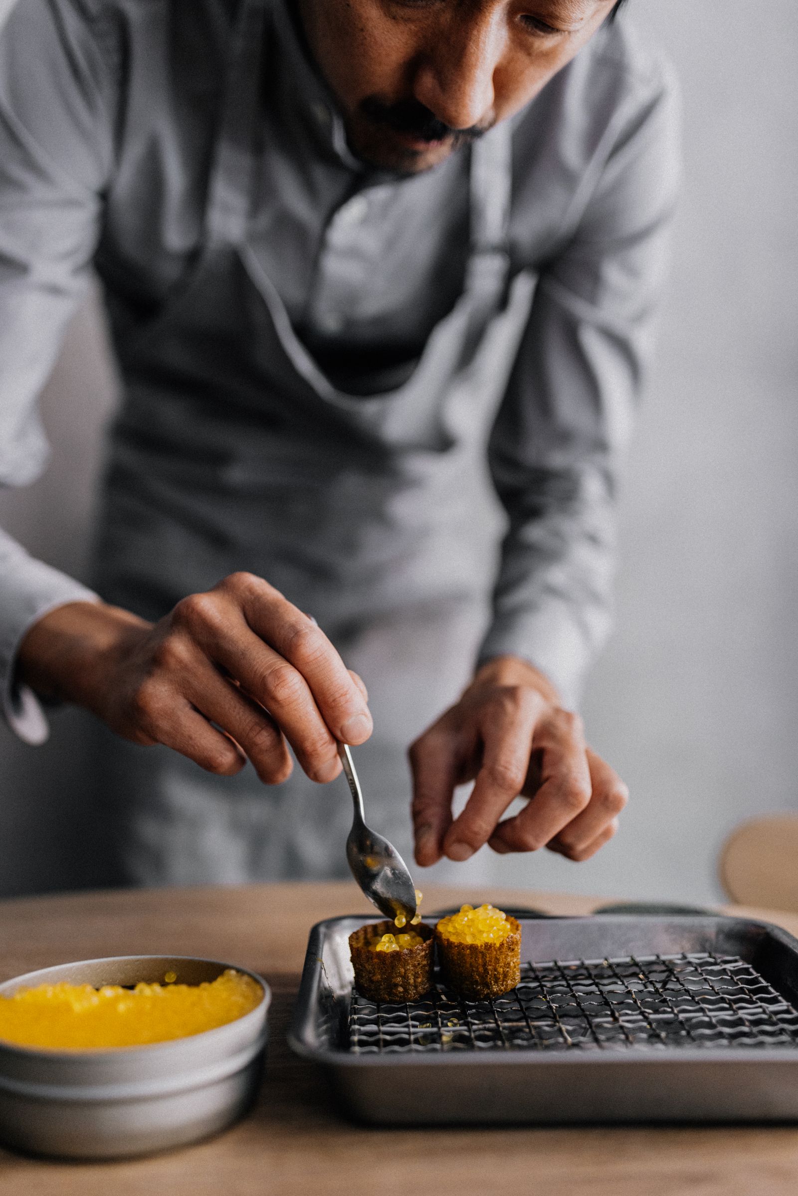 Image may contain Food Food Presentation Adult Person Cutlery and Spoon