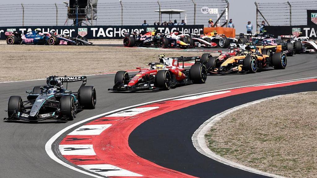 George Russell leads the field off the line at the China sprint race