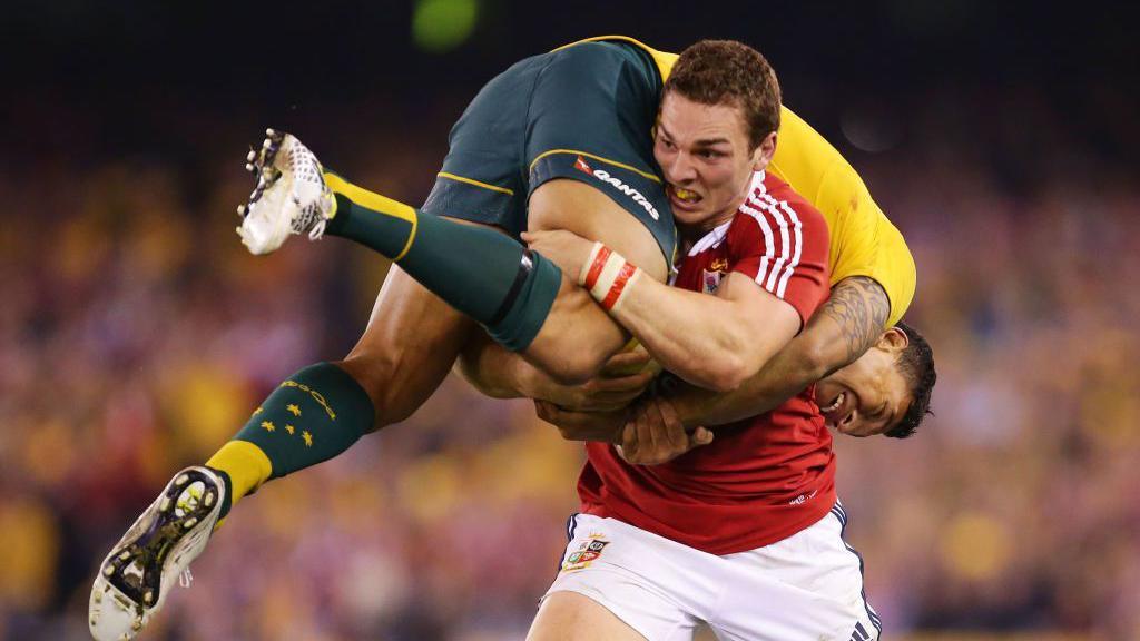 George North of the Lions lifts Israel Folau of Wallabies while carrying the ball during game two of the International Test Series between the Australian Wallabies and the British & Irish Lions at Etihad Stadium on June 29, 2013 in Melbourne, Australia.