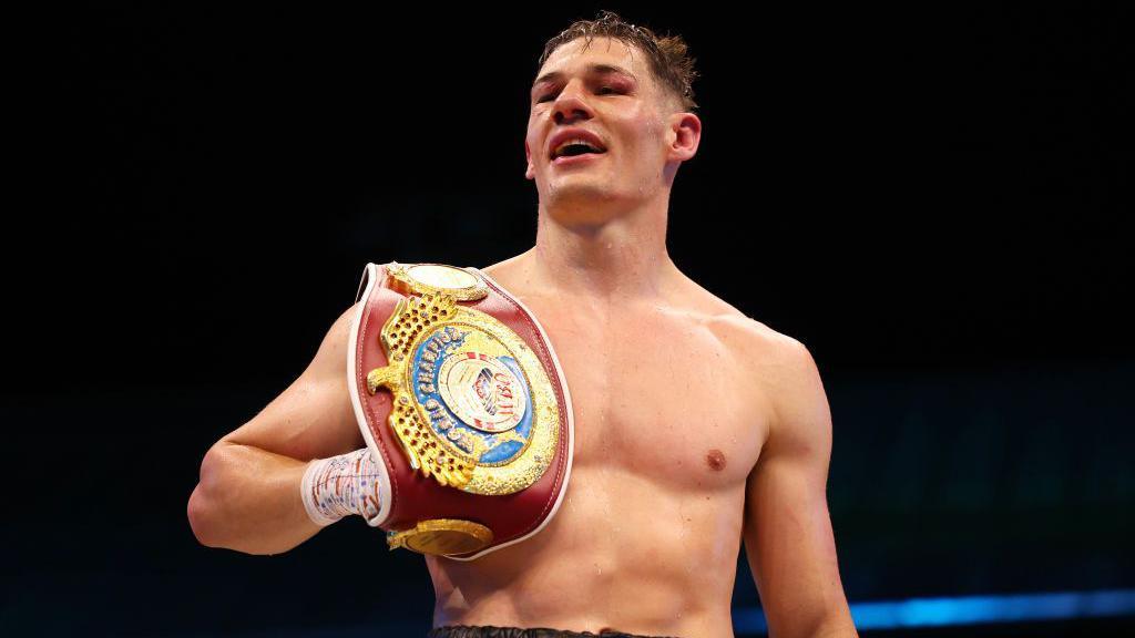 Chris Billam-Smith celebrates after retaining his WBO title