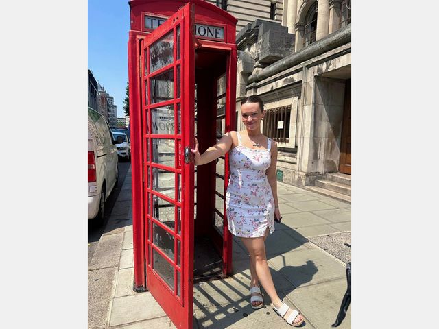 Image may contain: Clothing, Footwear, Sandal, Person, Teen, Accessories, Jewelry, Necklace, Phone Booth, and Car