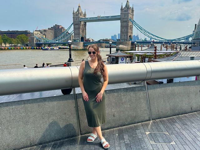 Image may contain: Adult, Person, Bridge, Landmark, and Tower Bridge