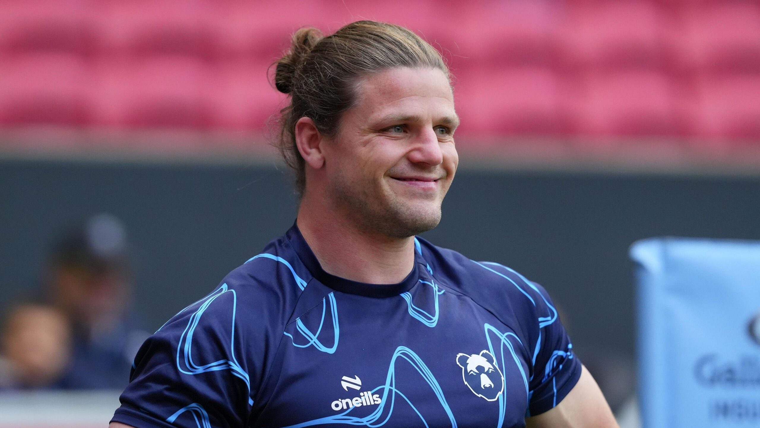 Harry Thacker standing with his hands on his hips and a smile on his face during a pre-game warm-up at Ashton Gate before Bristol's game v Gloucester