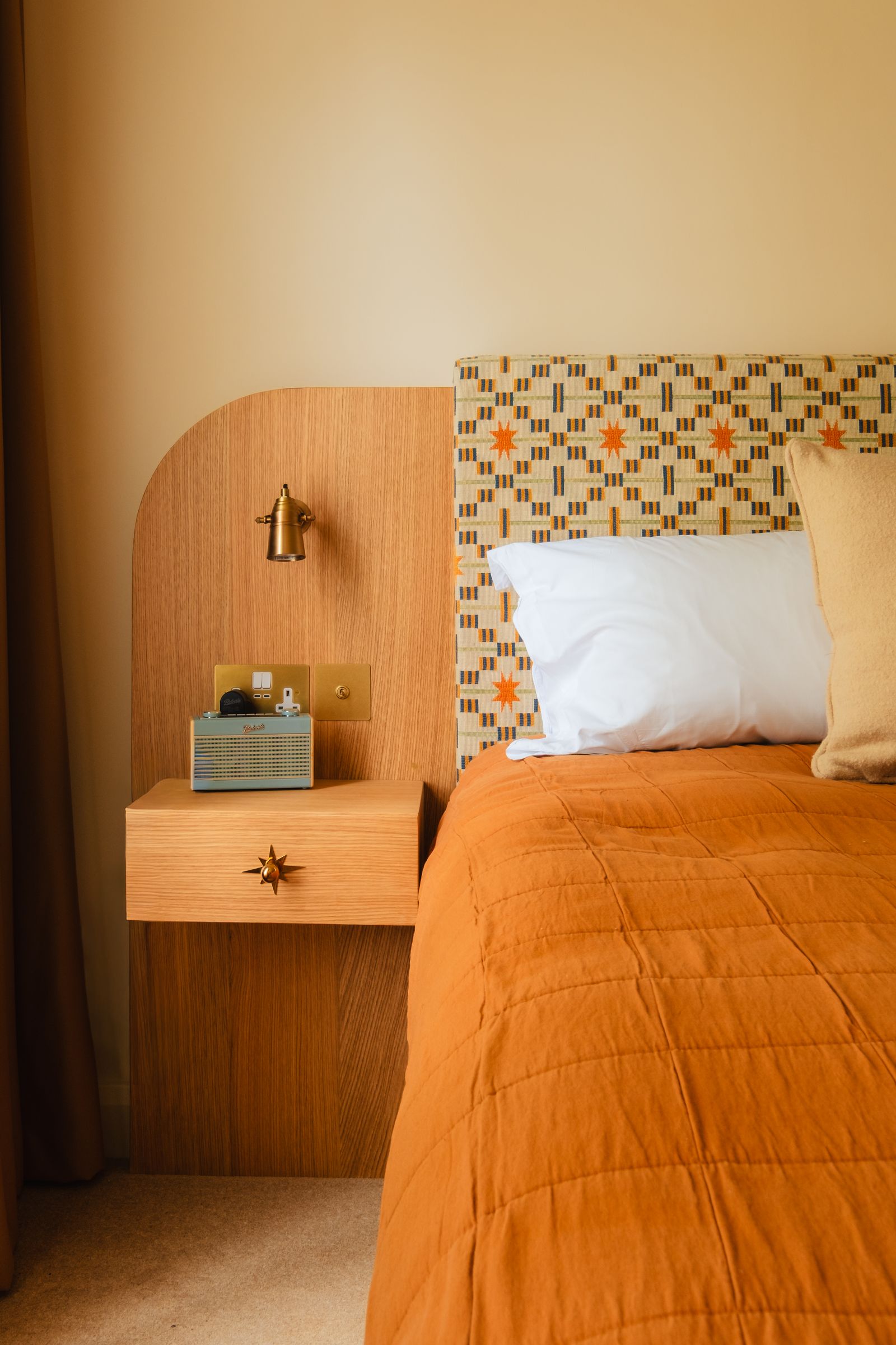 Image may contain Indoors Interior Design Cushion Home Decor Pillow Furniture Bed Bedroom Room and Wood Panels