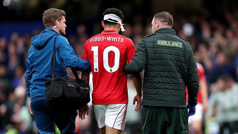 Morgan Gibbs-White is taken off against Chelsea after a clash of heads