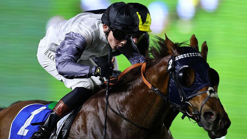 Billy Loughnane riding the horse Two Tribes to victory in a race in Dubai