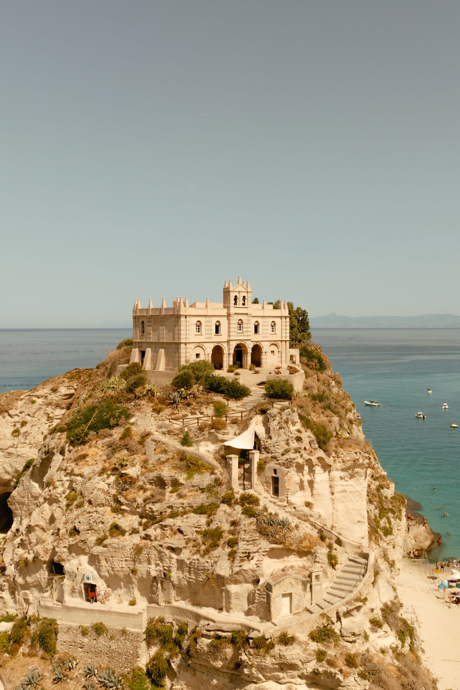 Image may contain Architecture Building Castle Fortress Nature Outdoors Sea Water Cliff Coast and Shoreline