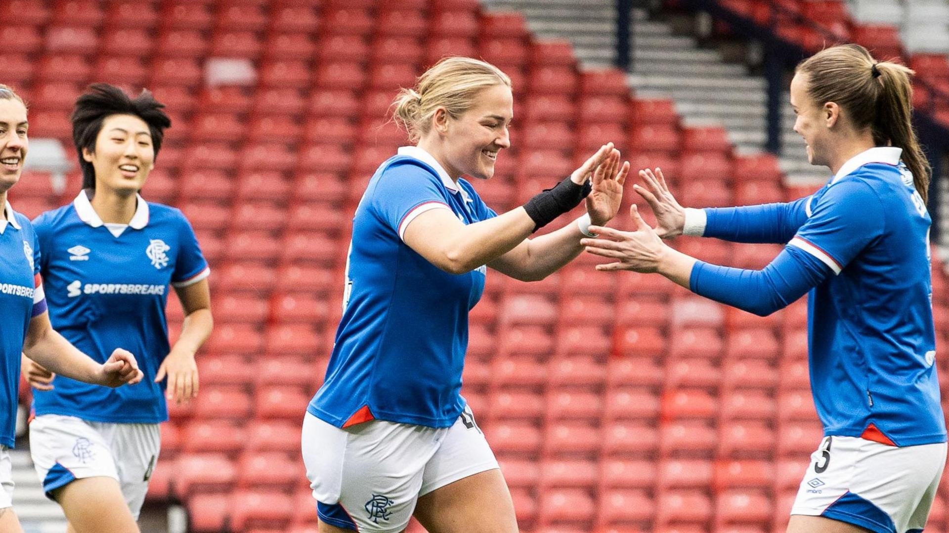 Katie Wilkinson celebrates with Leah Eddie