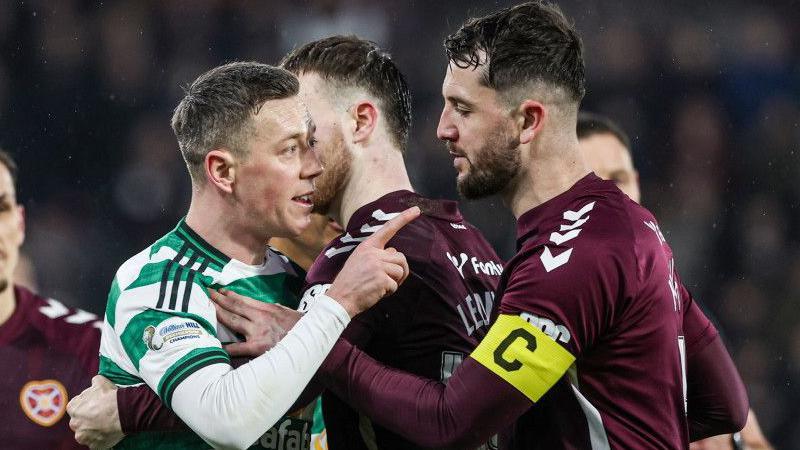 Celtic's Callum McGregor clashes with Hearts' Blair Spittal (not in frame) during a William Hill Premiership match between Heart of Midlothian and Celtic at Tynecastle Park, on January 25, 2026, in Edinburgh, Scotland.