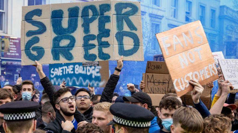Fans outside Stamford Bridge protest against the proposed European Super League in 2021.