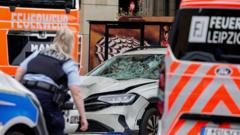 Two killed and many injured after car driven into crowd in German city of Leipzig Two killed and many injured after car driven into crowd in German city of Leipzig