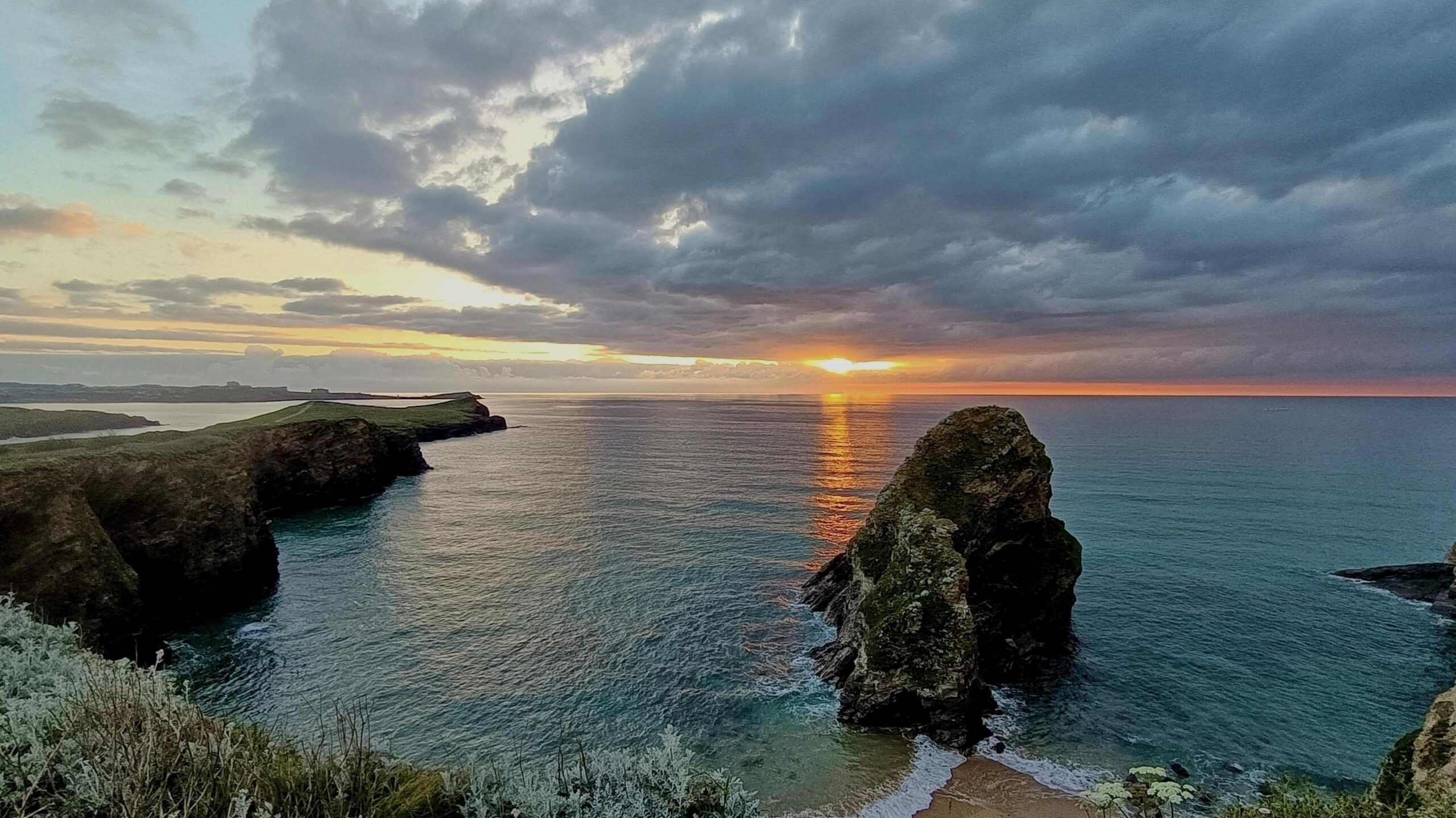 View of a sunset from a rocky coastline