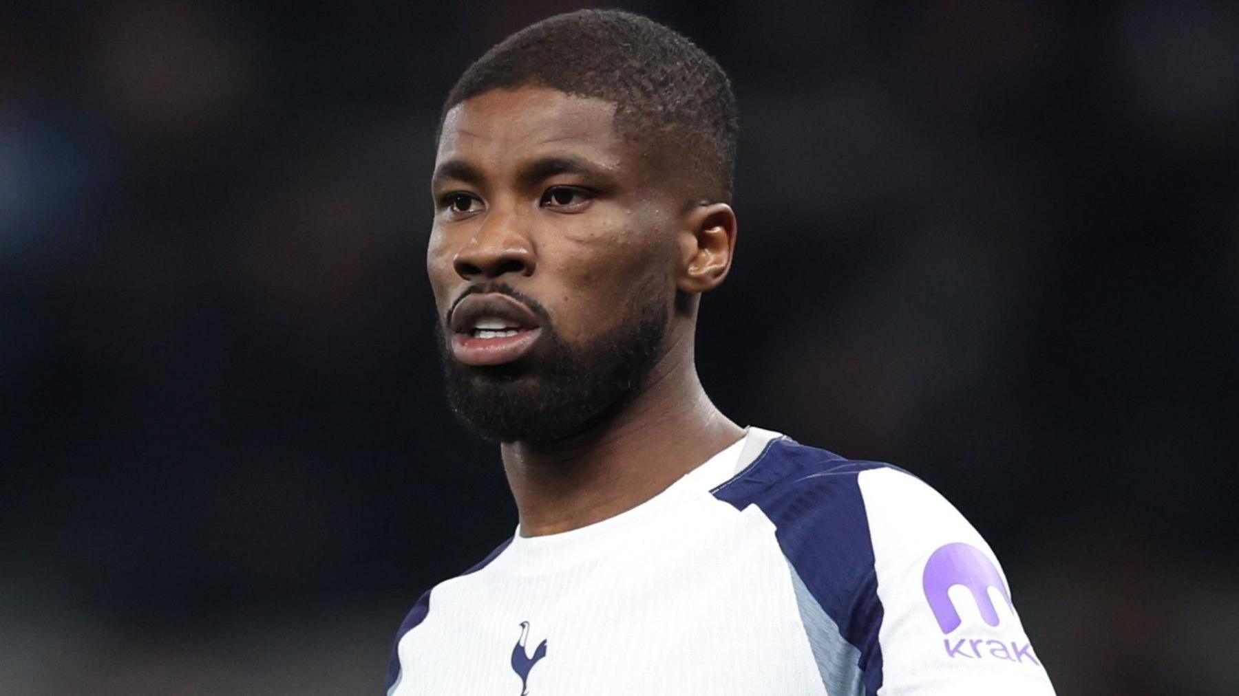 Kevin Danso looks on while playing for Tottenham