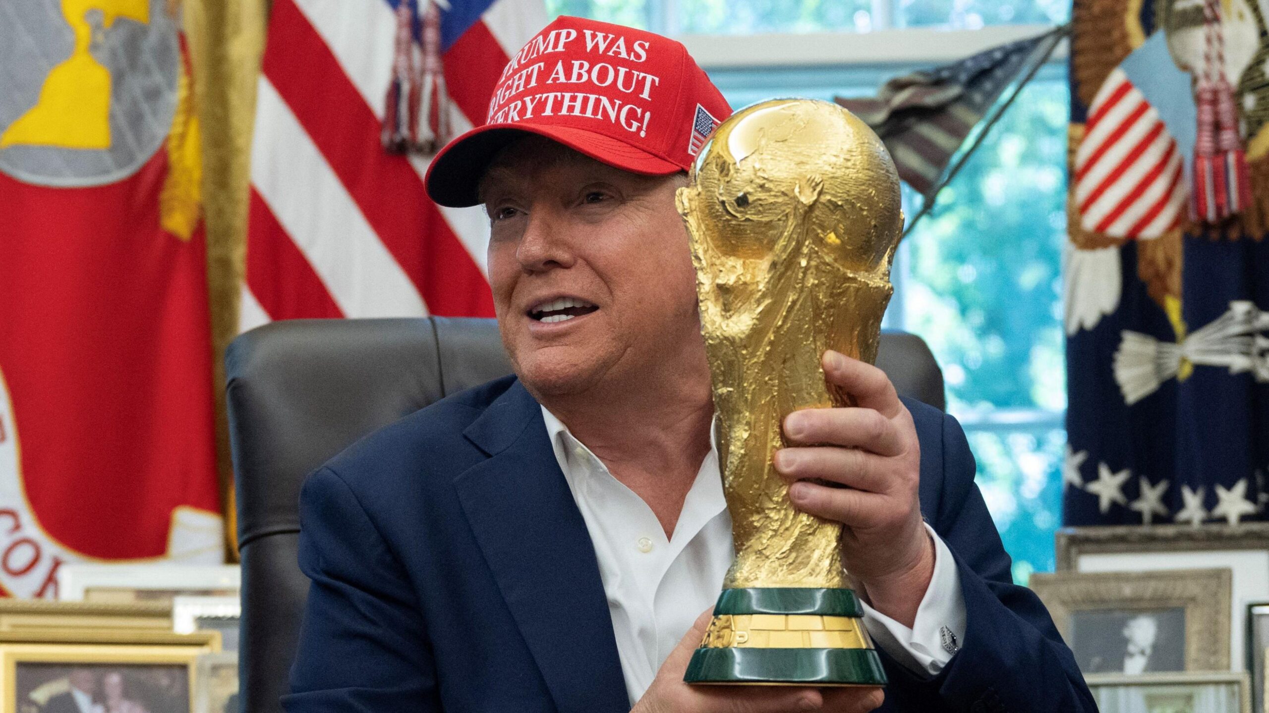 US President Donald Trump holding the World Cup trophy