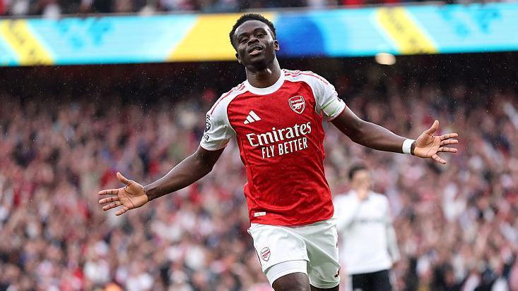 Bukayo Saka celebrates