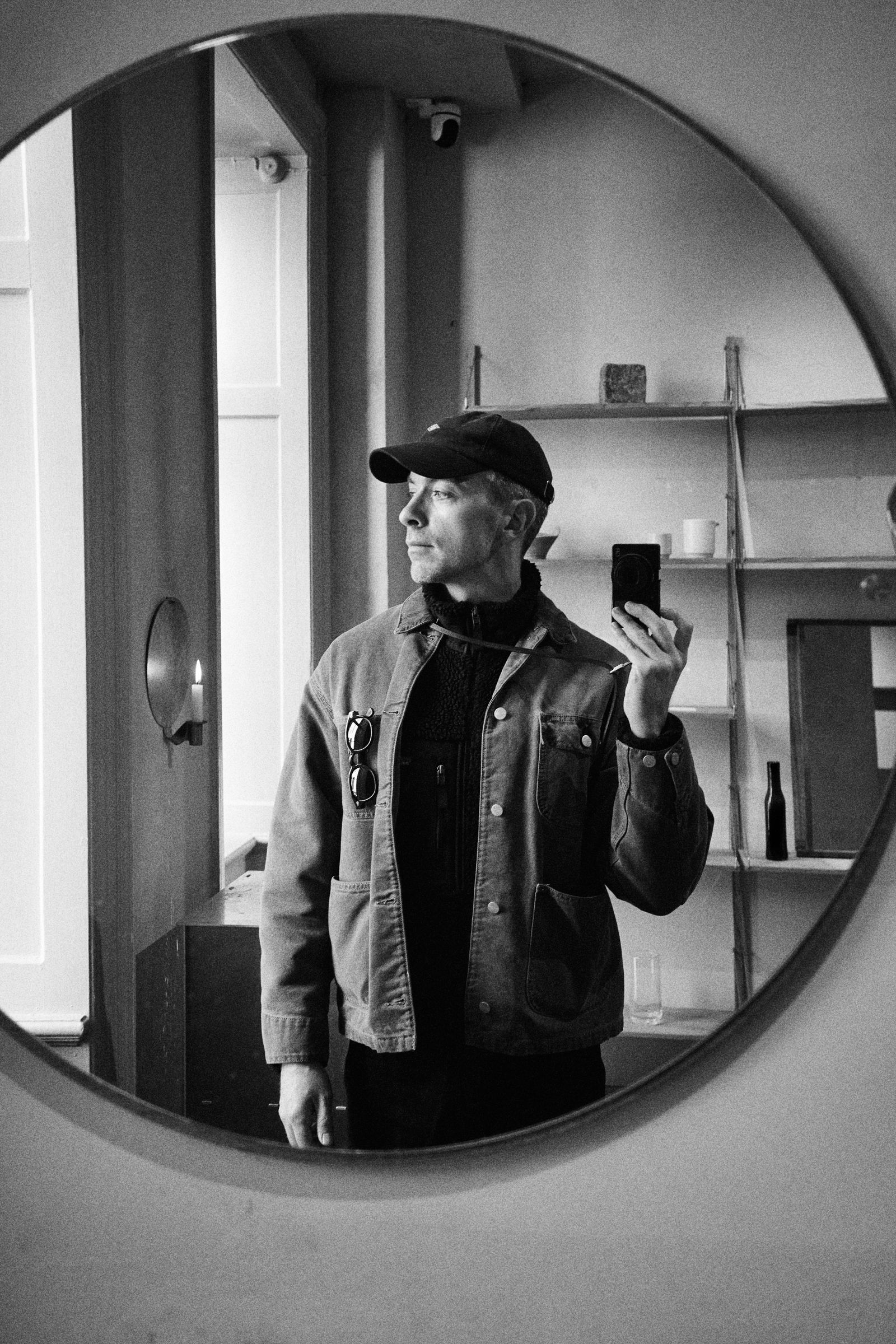 Image may contain Photography Clothing Coat Jacket Adult Person Face Head Portrait and Hat