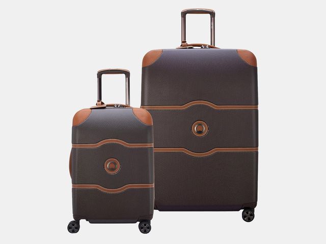 Two brown rolling suitcases
