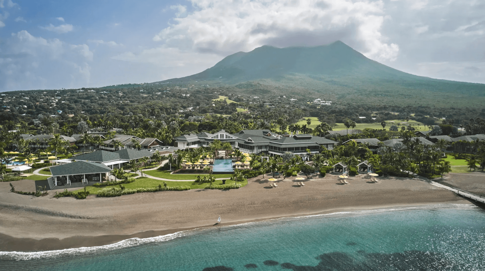 Image may contain Architecture Building Hotel Resort Nature Outdoors Sea Water Pool Swimming Pool and Summer