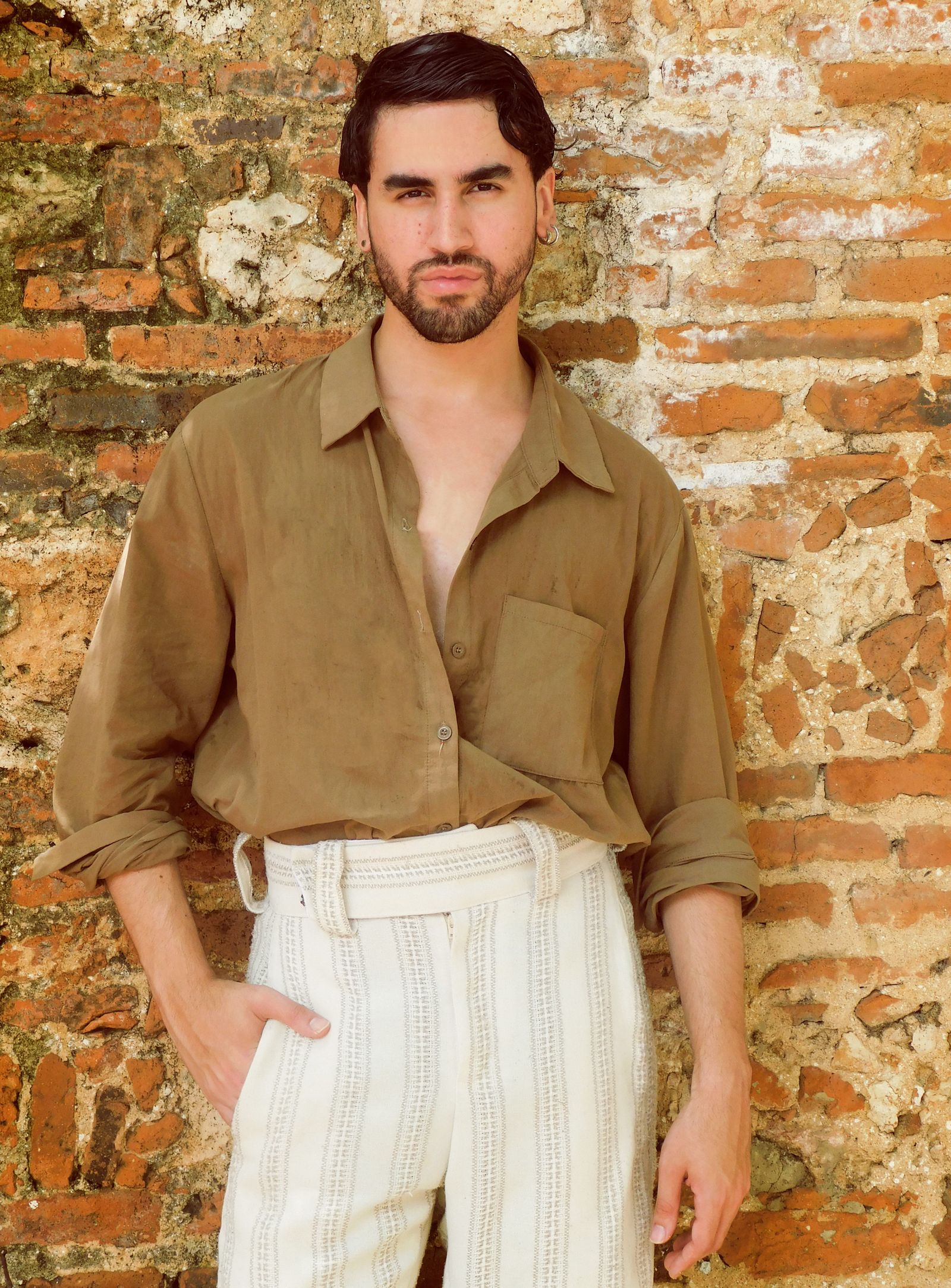 Image may contain Clothing Sleeve Adult Person Pants and Shirt