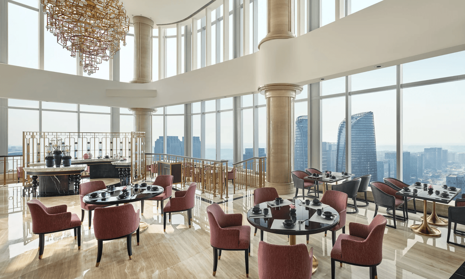 Image may contain Architecture Building Furniture Indoors Lounge Dining Room Dining Table Room Table and Chair