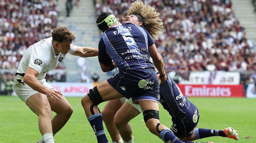 Alfie Barbeary is tackled high
