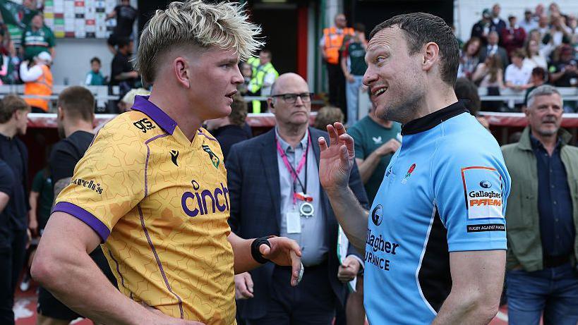 Referee Matt Carley speaks to Henry Pollock