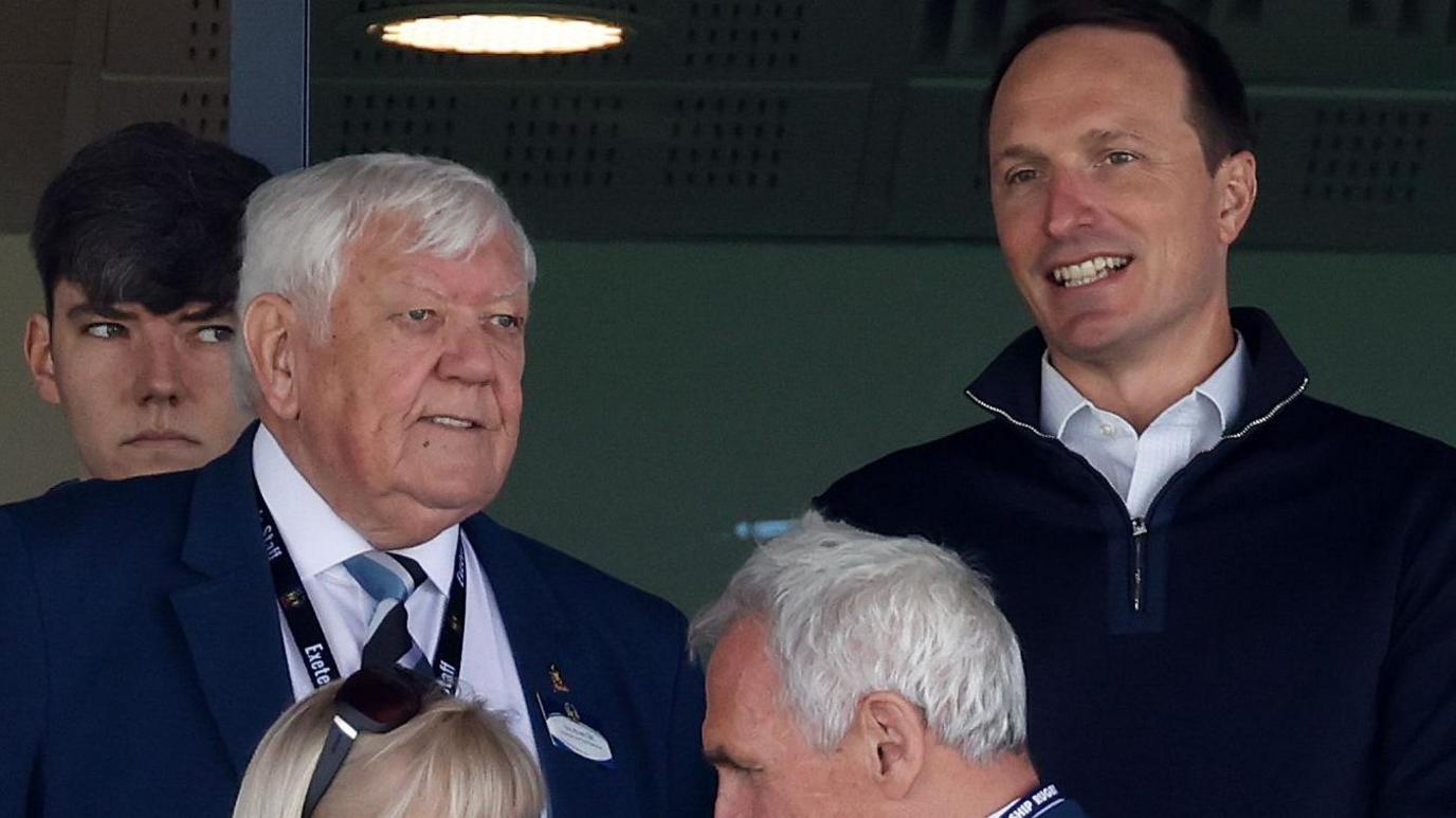 Exeter chief executive Tony Rowe (left) watches Exeter's last Prem game at Sandy Park with Cannae Holdings' Ryan Caswell