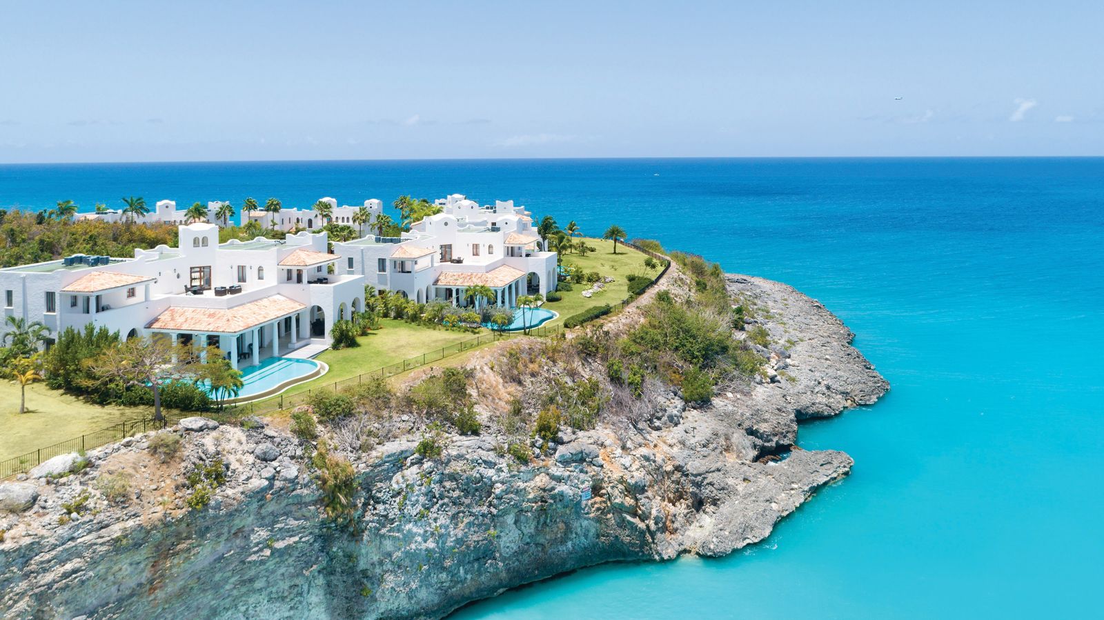 Image may contain Architecture Building Nature Outdoors Sea Water Shoreline Coast and Scenery