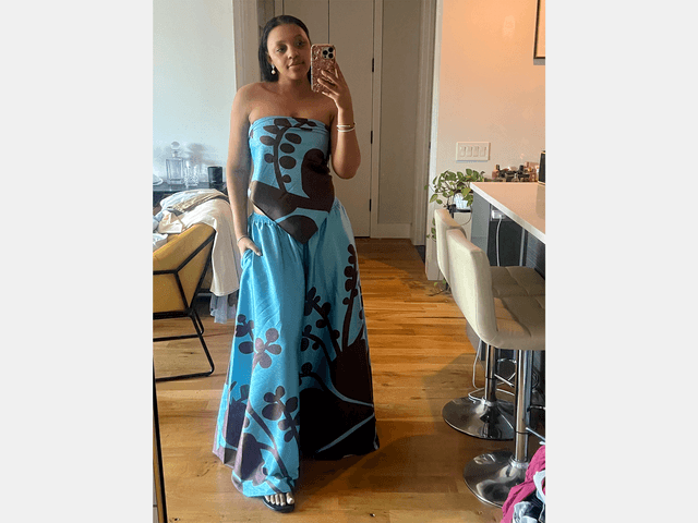 Image may contain: Clothing, Dress, Evening Dress, Formal Wear, Wood, Adult, Person, Fashion, Gown, Hardwood, and Floor