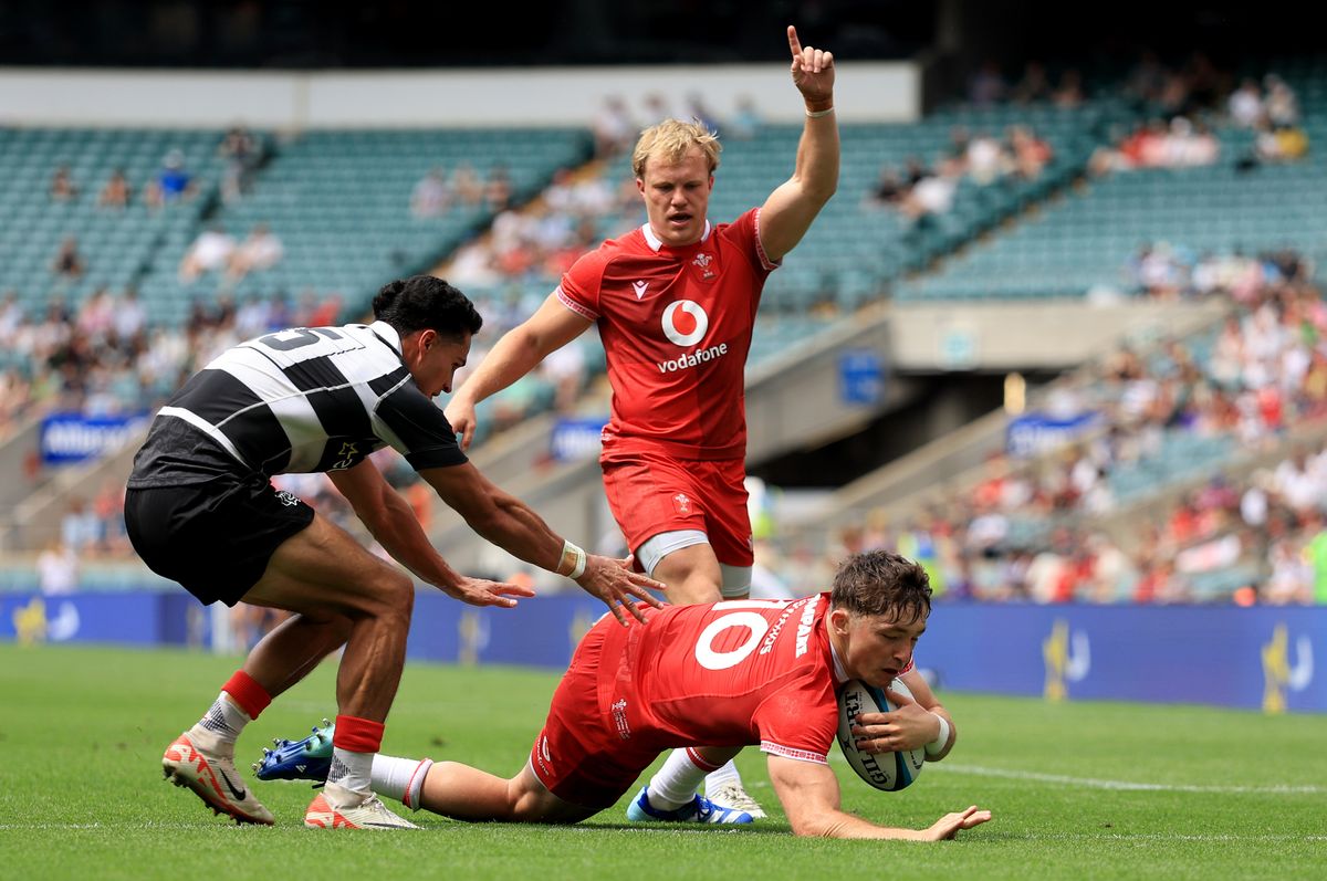Wales' Dan Edwards (right) scores a try