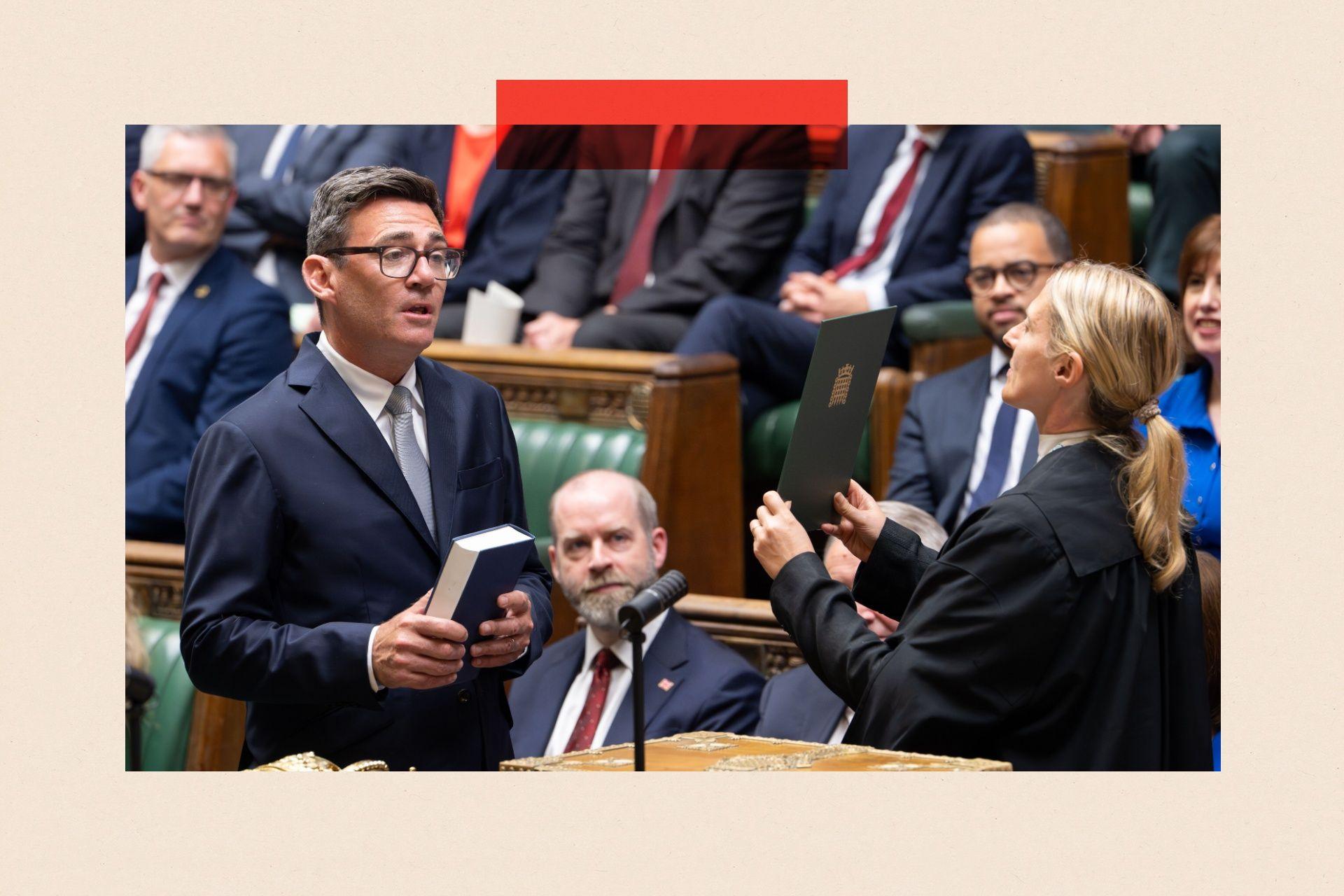 A handout photo made available by the UK Parliament shows Andy Burnham being sworn in as the Member of Parliament for Makerfield in the House of Commons chamber